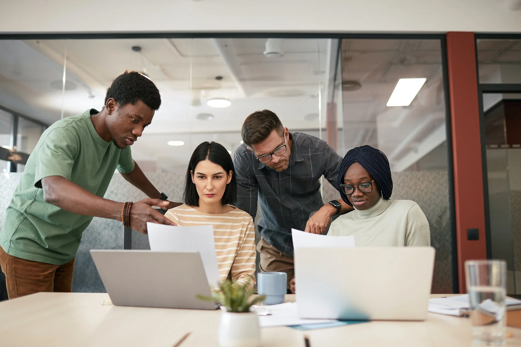 employees working with laptops